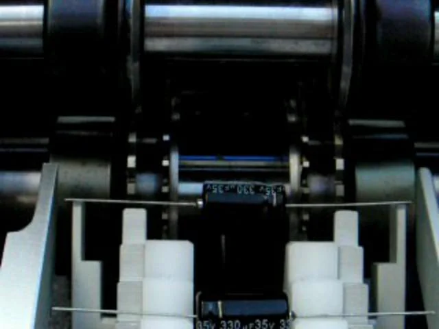 Olamef CS10 Loose Axial Component Feeder for TP6 machines on Vimeo
