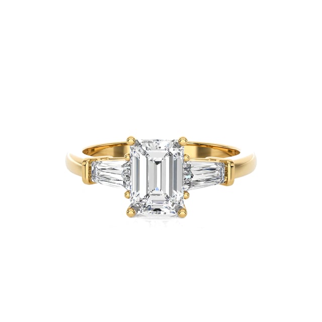 2.00 carat trilogy ring in yellow gold with a lab grown emerald cut diamond and lab gown tapered baguettes