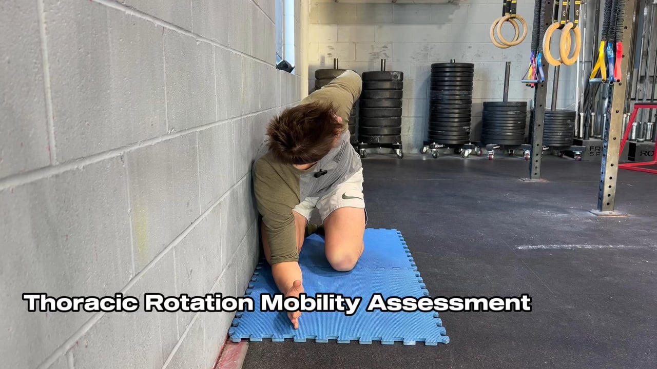 Spencer demonstrating the thoracic rotation test