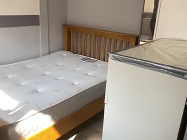 Video 1: Single room with small double bed.