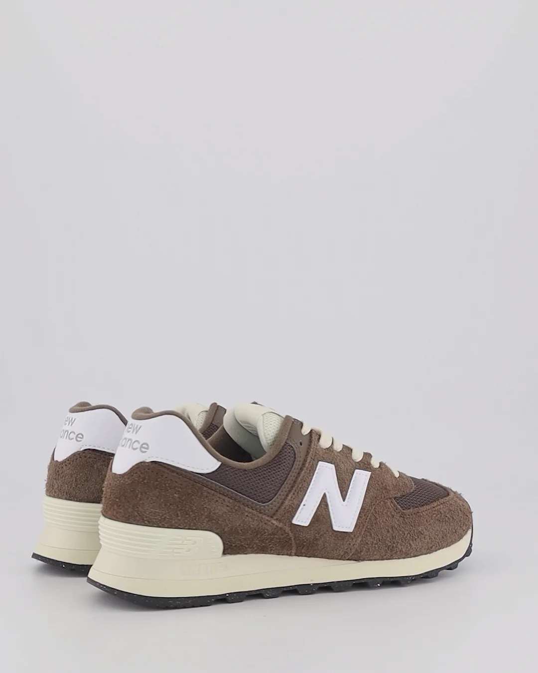 Shop New Balance, New Balance, New Balance 574 in Brown