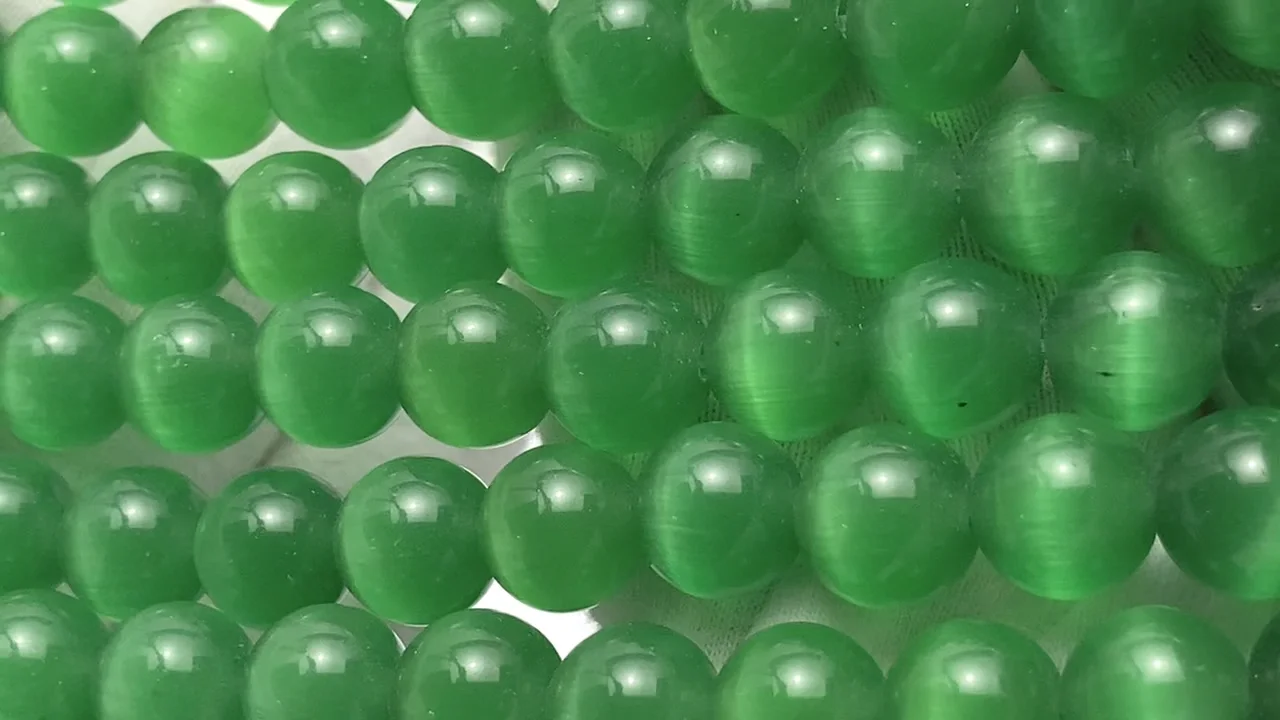 グリーンカラーキャッツアイ ラウンド10mm 1連｜天然石ビーズの卸問屋