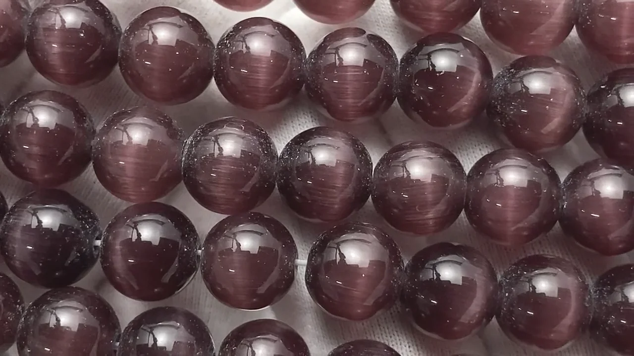 パープルカラーキャッツアイ ラウンド10mm 1連｜天然石ビーズの卸問屋