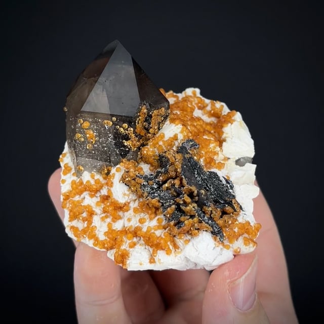 Spessartine, Smoky Quartz, and Hematite on Feldspar