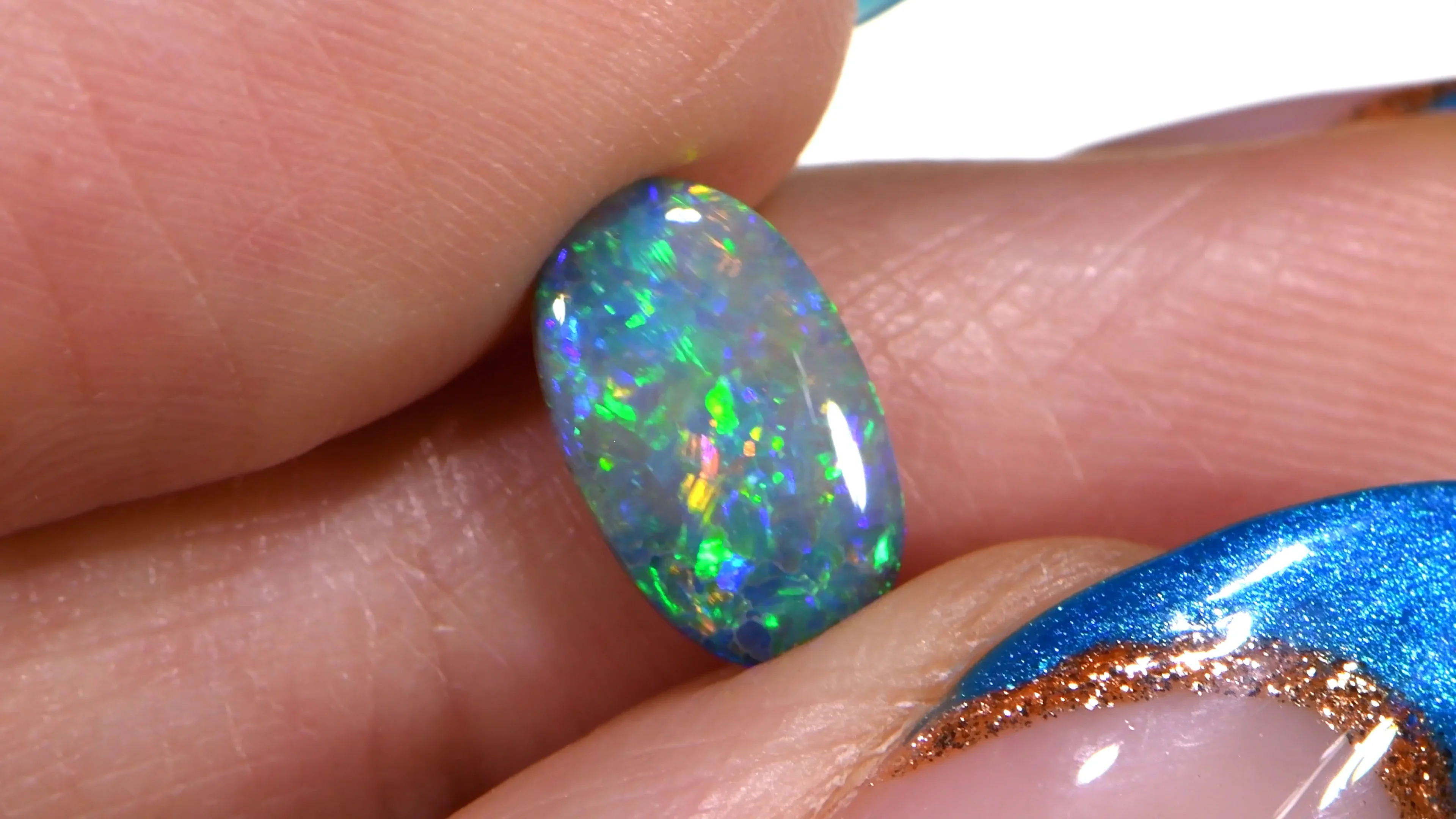 0.77ct Natural Dark Opal Multicolor fire