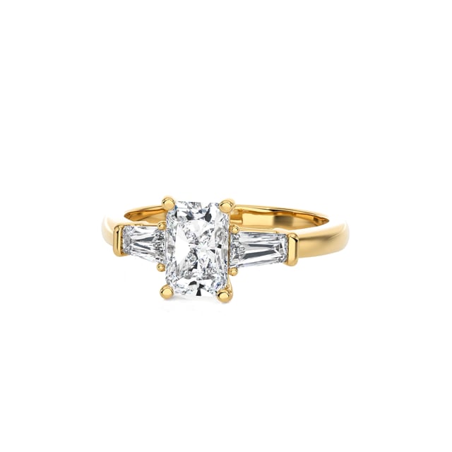 2.00 carat trilogy ring in yellow gold with a lab grown radiant cut diamond and lab gown tapered baguettes