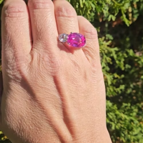 6ct Oval Cut Center and 2 Oval Cut Stones of 3 TCW  on the sides. Center stone size: 14x10mm