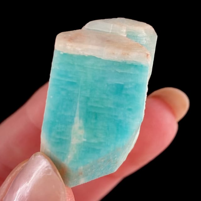 Microcline var: Amazonite (with white ''caps'')