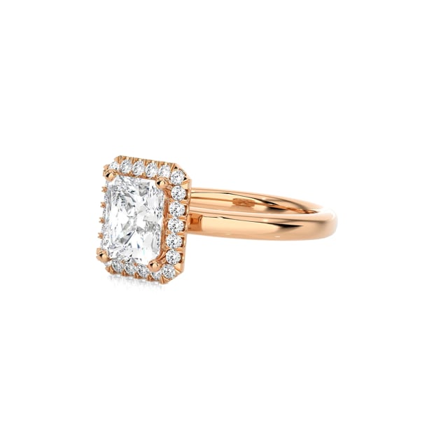 1.00 carat solitaire halo ring with a radiant cut diamond in red gold with round diamonds