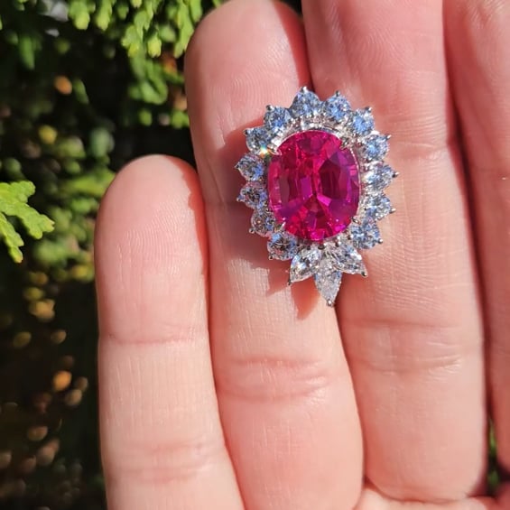 4ct Oval(12x10mm) Surround by Rounds and Pear shapes