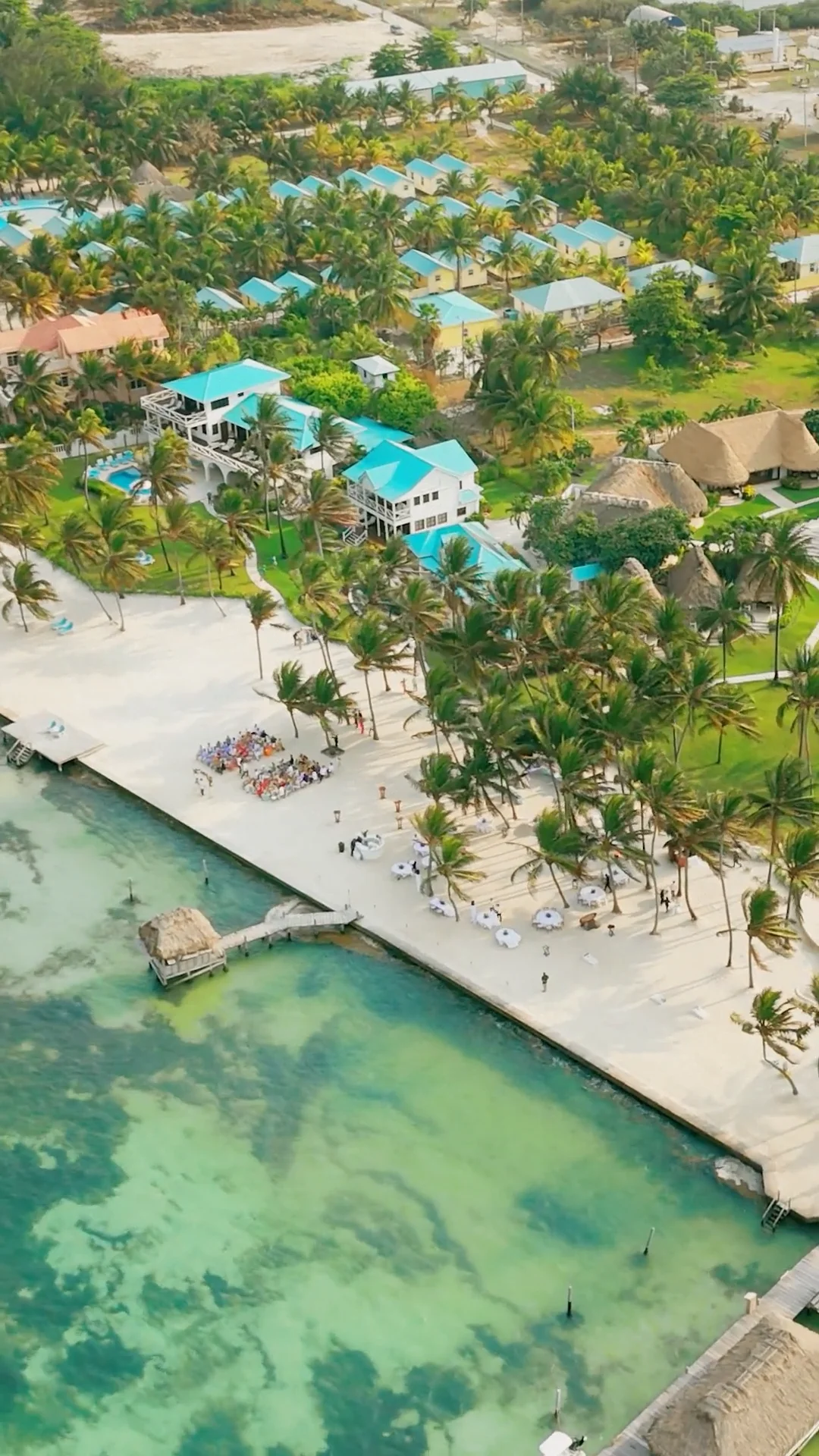 Poolside wedding venue at Victoria House Resort and Spa with tropical palm trees and elegant setup