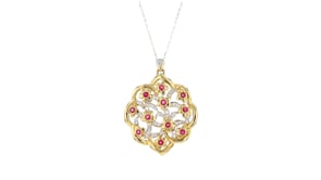C. 1980 Vintage 1.10 ct. t.w. Ruby and .60 ct. t.w. Diamond Floral Pendant Necklace in 18kt Yellow Gold