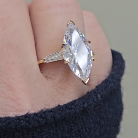 7.5ct Marquise Cut Center with 5ct Baguette Cut on the sides. Center stone size: 20x10mm 17152-10-CZ-14K