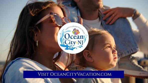 Family at the beach with Ocean City NJ logo in foreground.