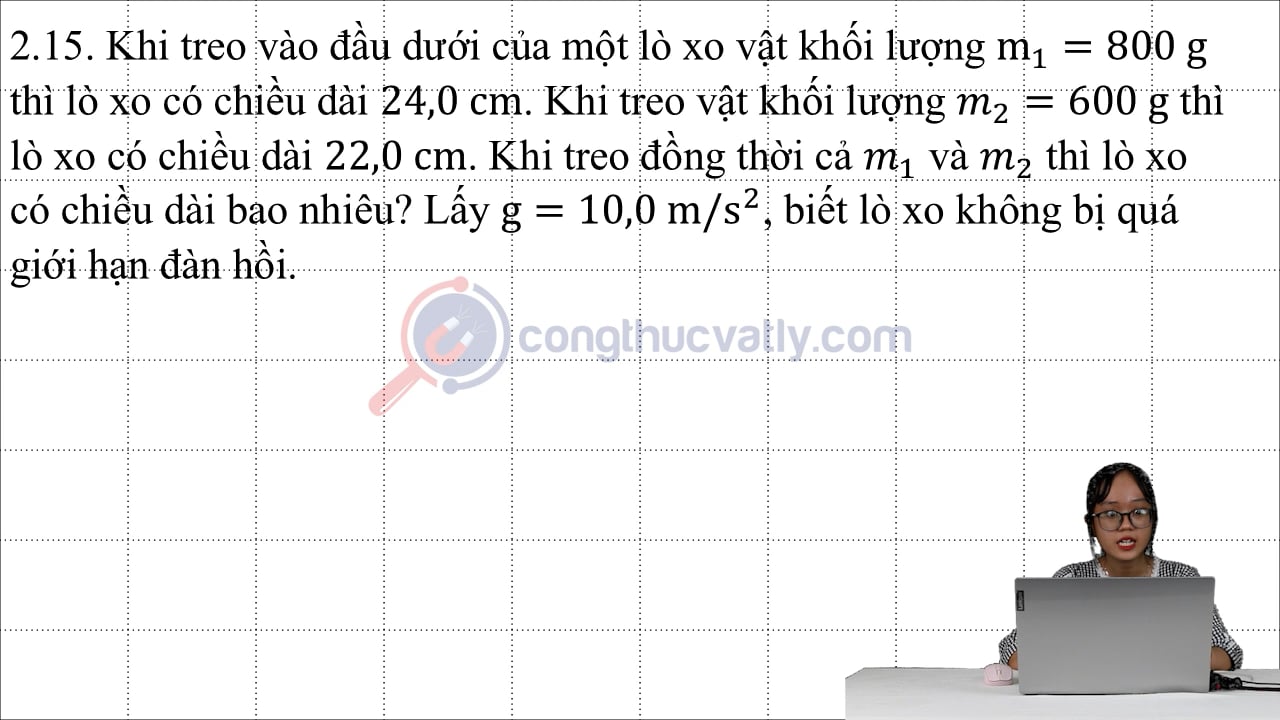Khi treo vào đầu dưới của một lò xo vật khối lượng m1 = 800 g thì lò xo có chiều dài 24,0 cm.