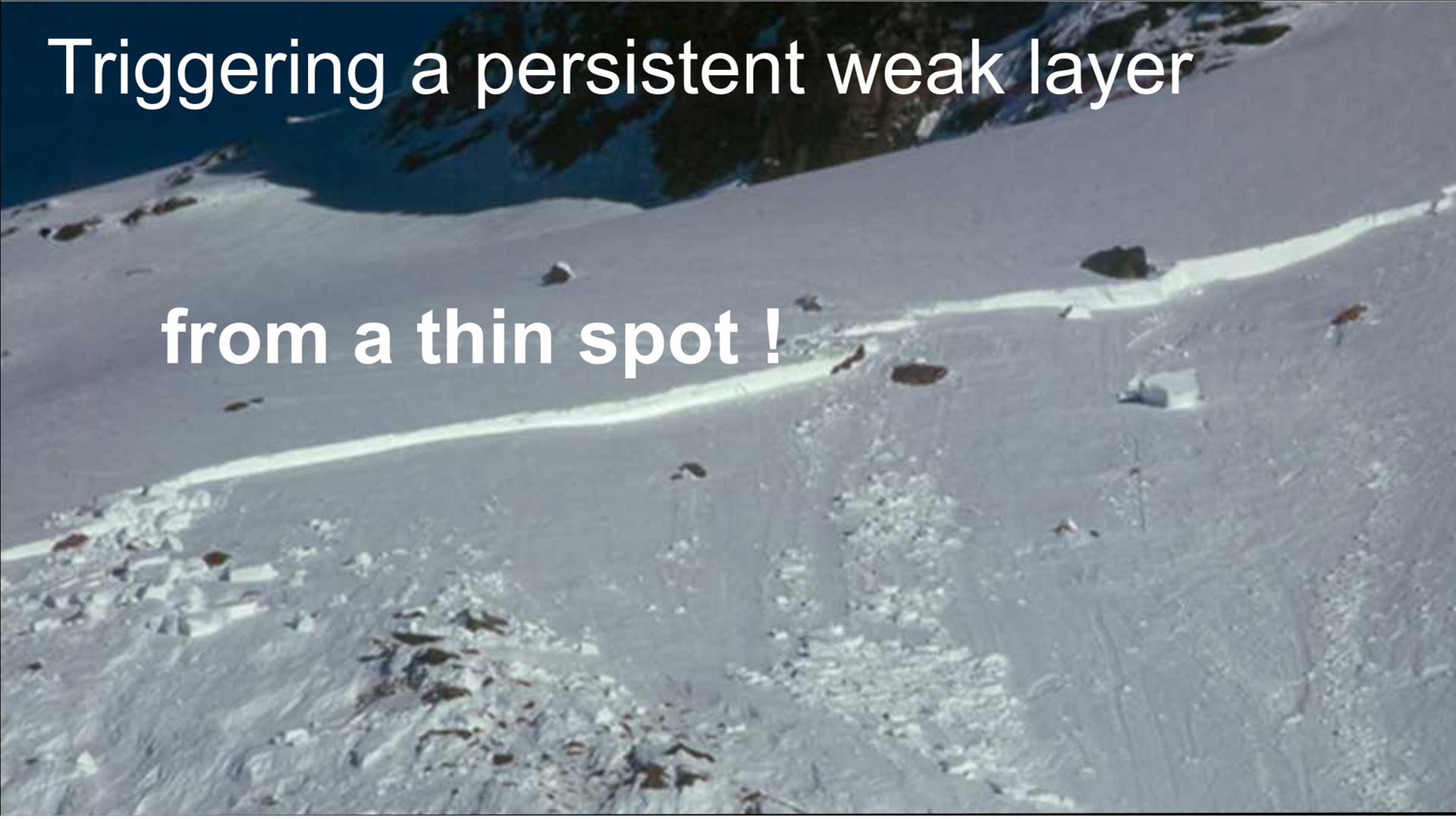 Triggering a persistent slab avalanche from a thin spot