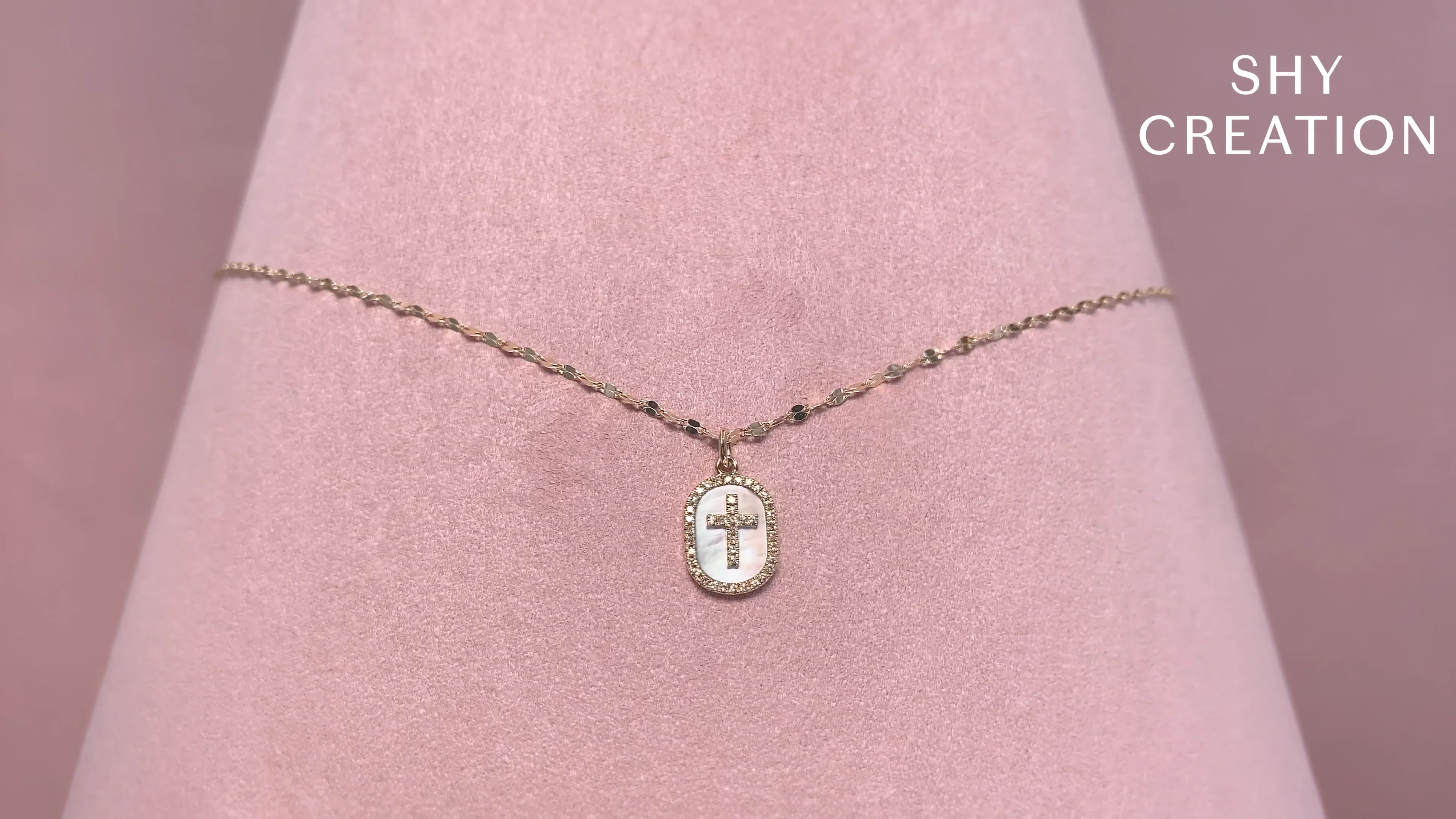 0.11CT DIAMOND & 0.95CT MOTHER OF PEARL OVAL CROSS SPARKLE CHAIN