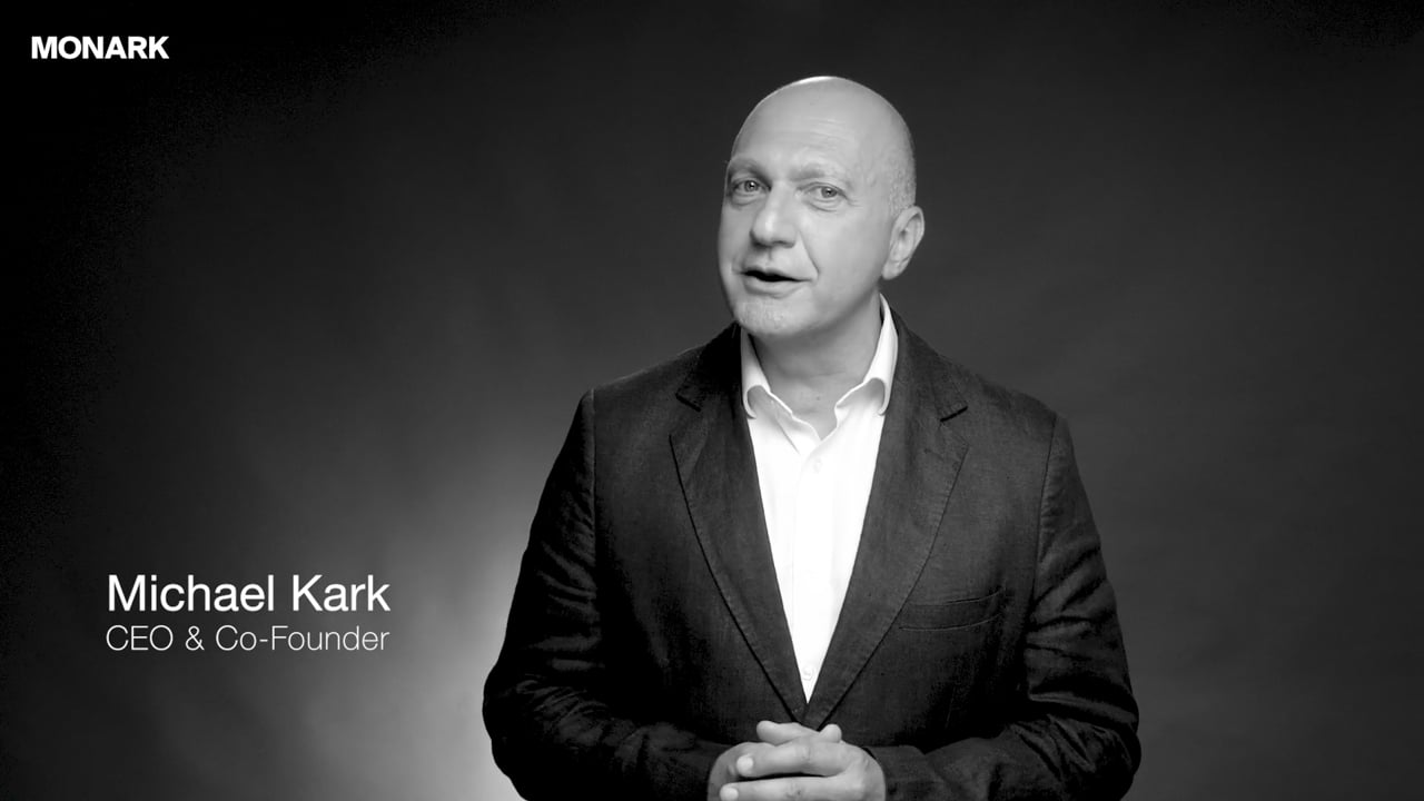 Michael Kark, CEO and co-founder of Monark Property Partners, speaking to camera, play his video