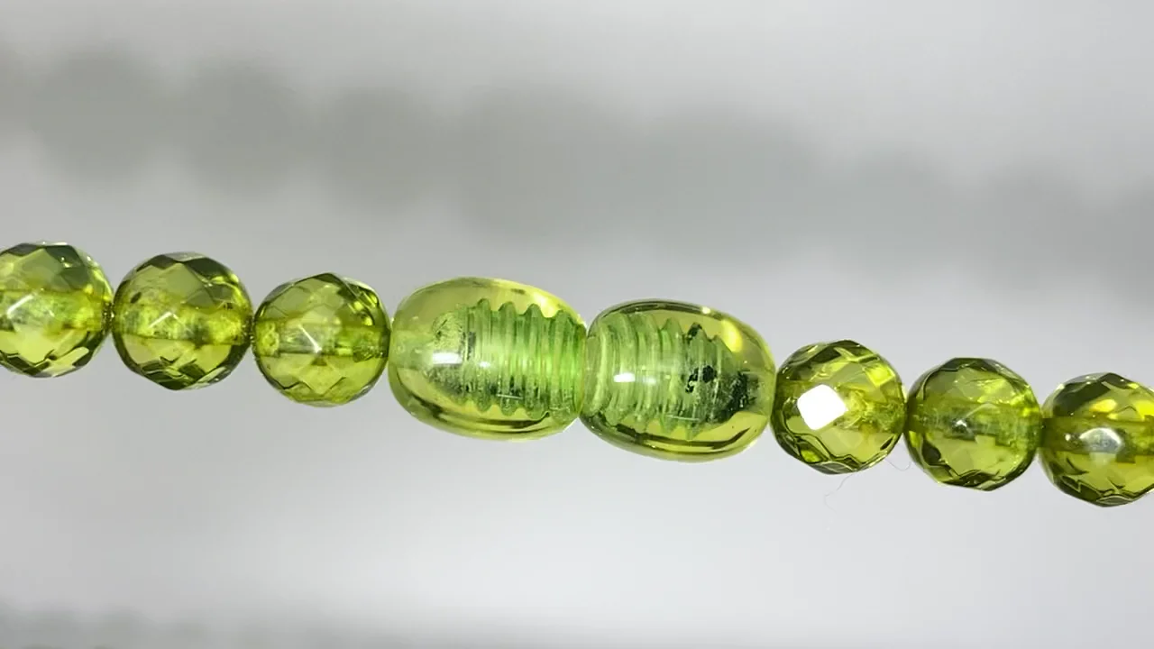 動画】【1点もの】グリーンアンバーAAA- ラウンドカット5.5mm 1連
