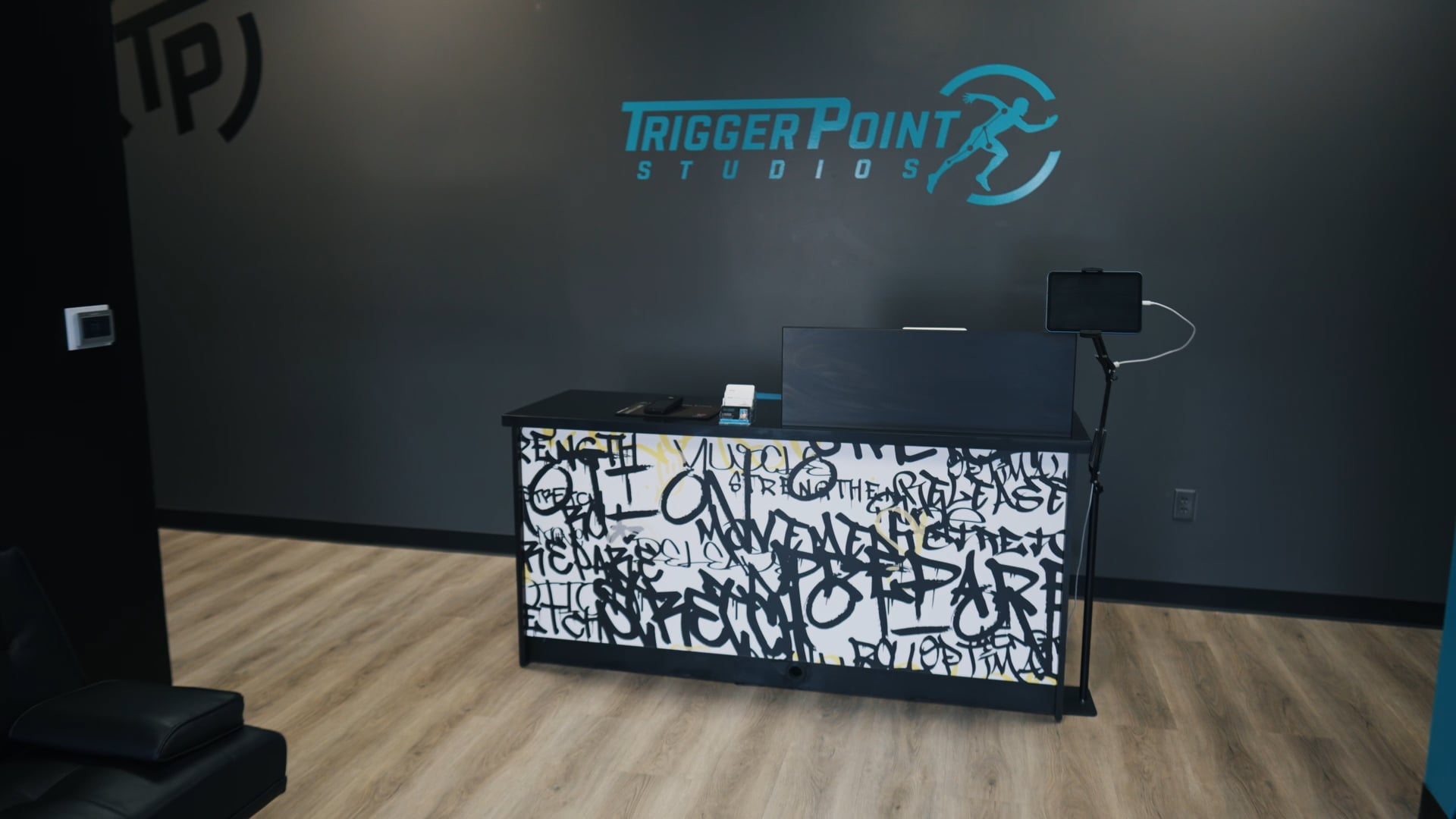 Clean, professional medical spa treatment room with neutral tones at Trigger Point Studios in Woodlands