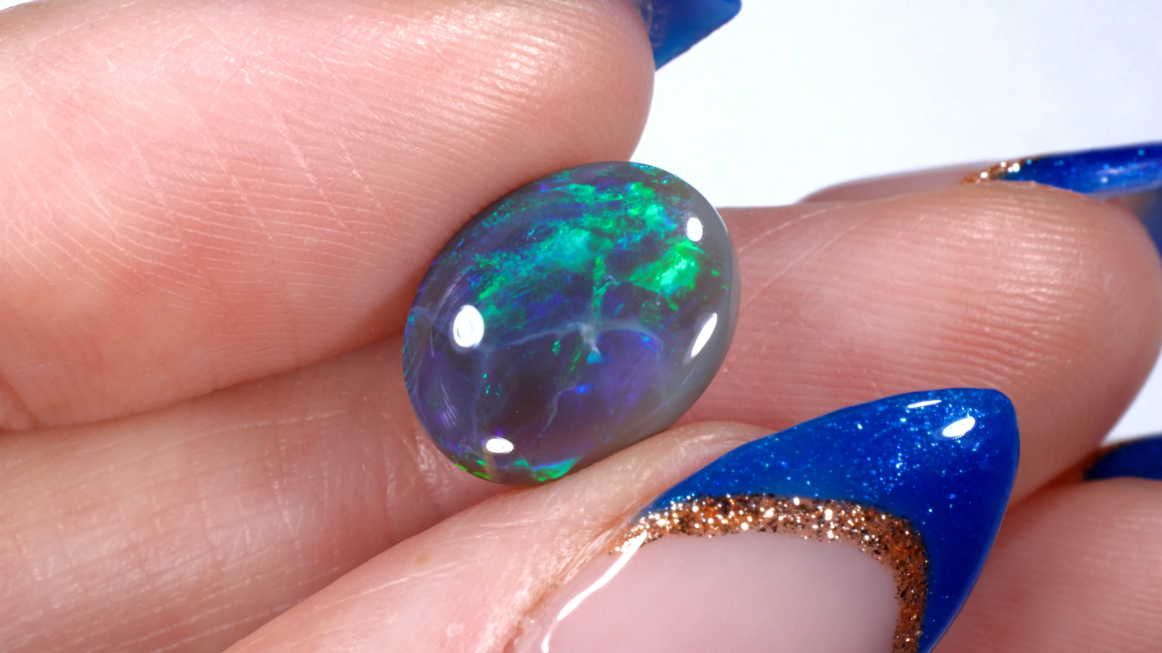 3.27ct Natural Dark Opal Oval Green Blue