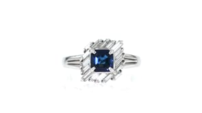 C. 2000 Vintage .79 Carat Sapphire and .52 ct. t.w. Diamond Halo Ring in Platinum