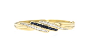 C. 1980 Vintage 1.50 ct. t.w. Sapphire and 1.00 ct. t.w. Diamond Bangle Bracelet in 18kt Yellow Gold