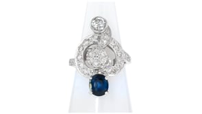C. 1980 Vintage 1.35 Carat Sapphire and 1.40 ct. t.w. Diamond Swirl Ring in Platinum and 14kt White Gold