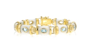 White Agate and 4.80 ct. t.w. Sky Blue Topaz Bracelet in 18kt Gold Over Sterling