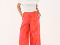 Orange jacquard wide leg trousers with pink flowers | My Jewellery