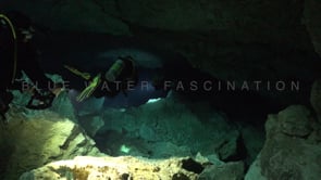 1377_Scuba divers swimming trough Cenote Tajma Ha, Yucatan Mexico.