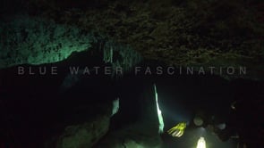 1382_divers illuminating stalagtites inside cenote Tajma Ha, Yucatan Mexico