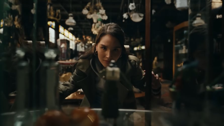 a woman looking at a camera