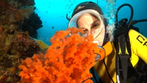 0521_female scuba diver in oval mask  with orange soft corals