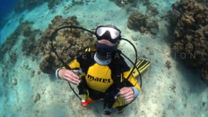 0523_Scuba diver blowing air bubble rings slow motion