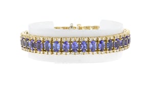 C. 1980 Vintage 18.50 ct. t.w. Tanzanite and 4.00 ct. t.w. Diamond Tennis Bracelet in 14kt Yellow Gold