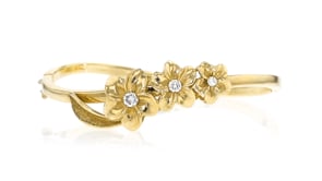 C. 2000 Vintage .35 ct. t.w. Diamond Flower Bangle Bracelet in 14kt Yellow Gold