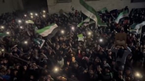 مشاركة قاسم جاموس في مظاهرة باب قبلي في مدينة حماة احتفالاً بانتصار الثورة السورية