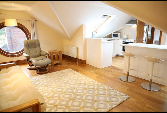 Large Studio Room over Attached Garage Main Photo