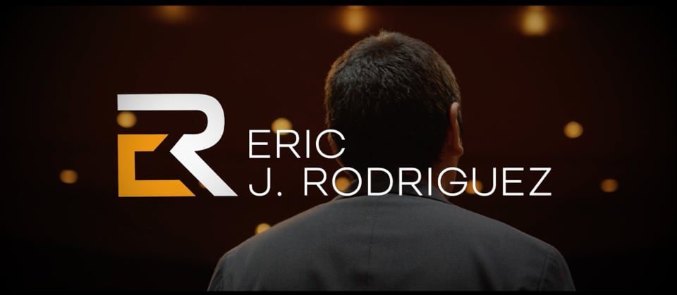 Eric J. Rodriguez speaking on stage