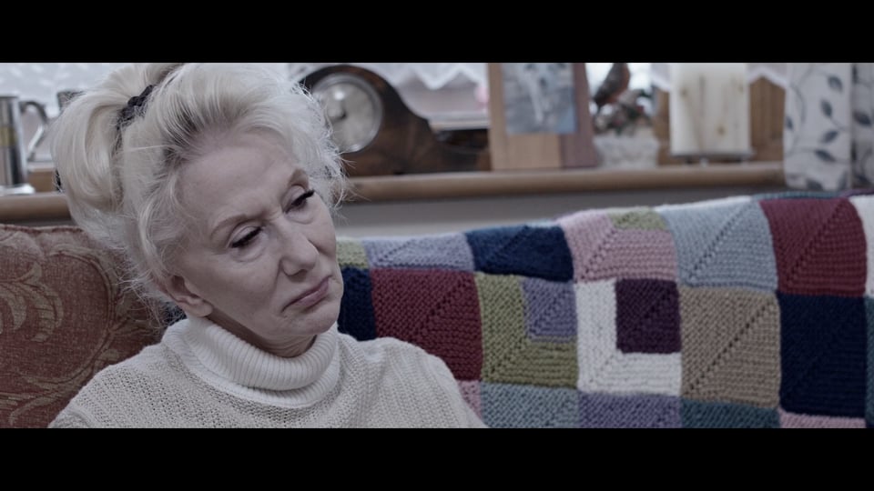 An sad older lady stressed about trying to afford to keep her pet in her home