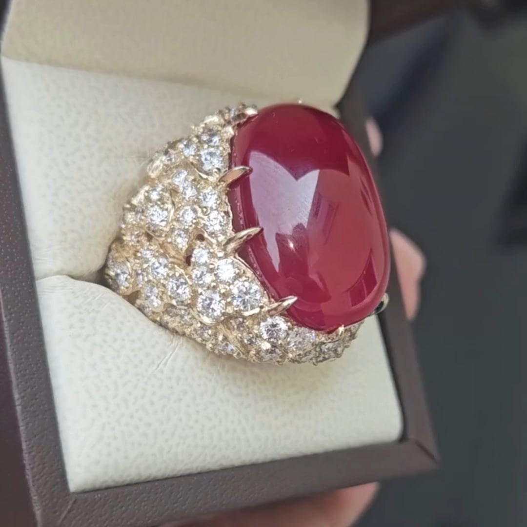 25 ct Large Oval Cabochon Center ring  with 140 Round cut stones of 10 Total Carat Weight.