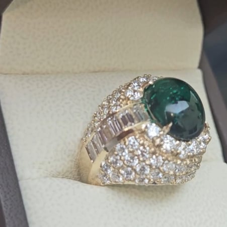 6.5ct Oval Cabochon Center with 12 Baguette cut stones (1.9ct) down each side  surrounded by 78 Round Cut stones (4.2ct)