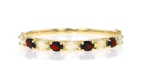 C. 1980 Vintage Opal and 5.20 ct. t.w. Garnet Bangle Bracelet in 14kt Yellow Gold