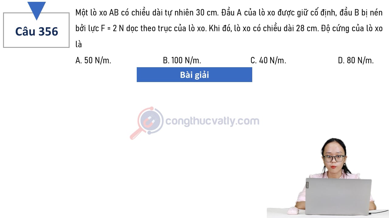 Một lò xo AB có chiều dài tự nhiên 30 cm. Đầu A của lò xo được giữ cố định, đầu B bị nén bởi lực F = 2 N dọc theo trục của lò xo. Độ cứng của lò xo là