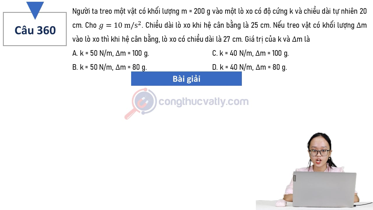 Người ta treo một vật có khối lượng m = 200 g vào một lò xo có độ cứng k và chiều dài tự nhiên 20 cm. Giá trị của k và delta m là