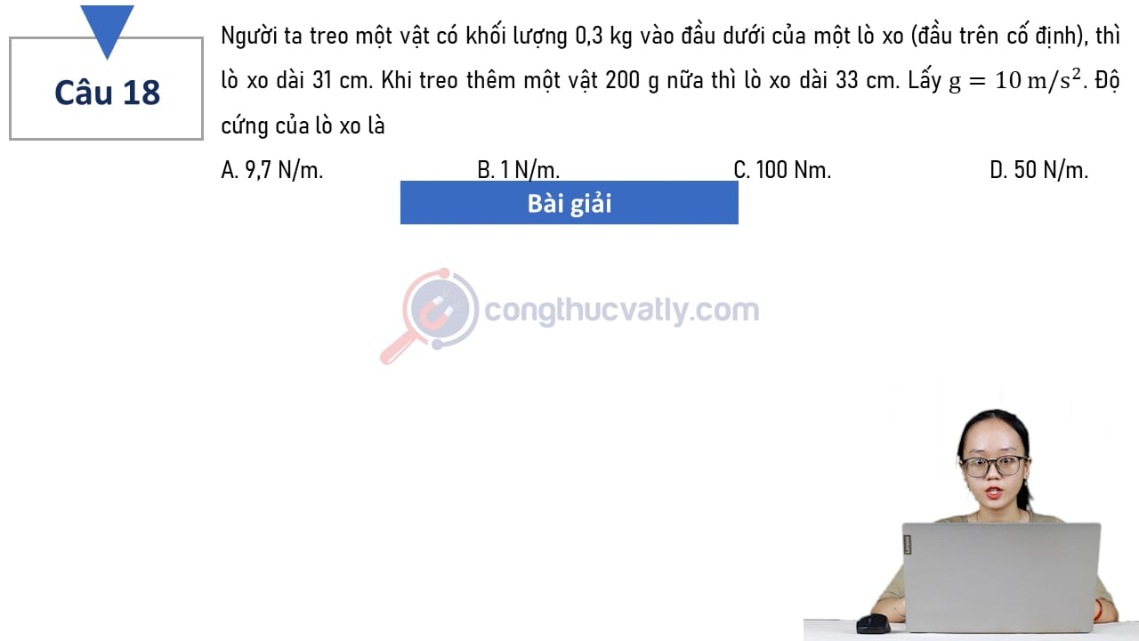 Người ta treo một vật có khối lượng 0,3 kg vào đầu dưới của một lò xo (đầu trên cố định), thì lò xo dài 31 cm. Độ cứng của lò xo là