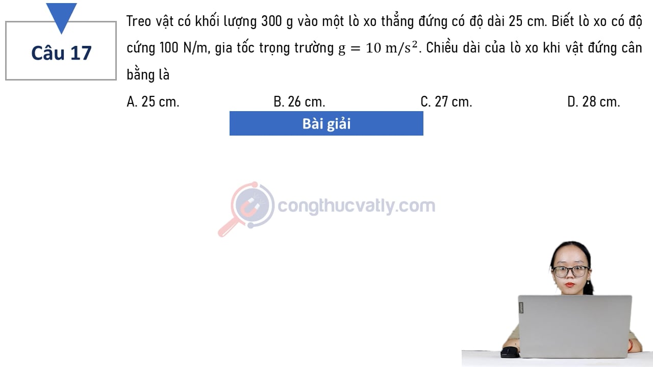 Treo vật có khối lượng 300 g vào một lò xo thẳng đứng có độ dài 25 cm. Chiều dài của lò xo khi vật đứng cân bằng là
