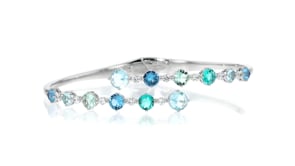 Rhodium-Plated Bypass Bangle Bracelet with Simulated Tonal-Blue Gemstones and 3.80 ct. t.w. CZs