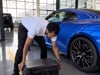 Genuscars founder professionally wrapping a car.MOV